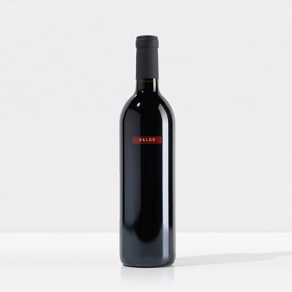 A bottle of SALDO Zinfandel California red wine, featuring a dark glass bottle with a red and black label, on a solid white background.