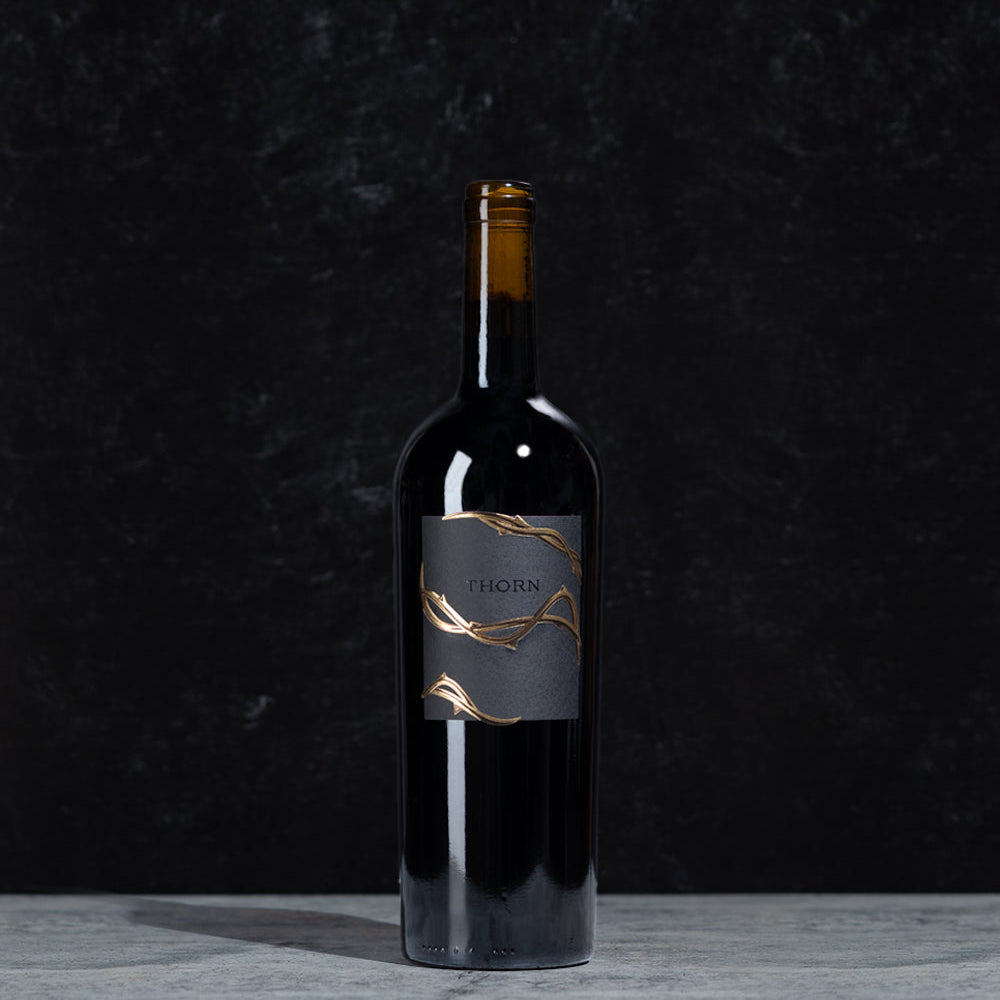 Thorn Merlot bottle of wine on a black background