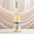 Bottle of Blindfold Chardonnay on a beige draped background