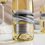 Wine bottle labeled 'Blindfold Chardonnay' with a blurred background