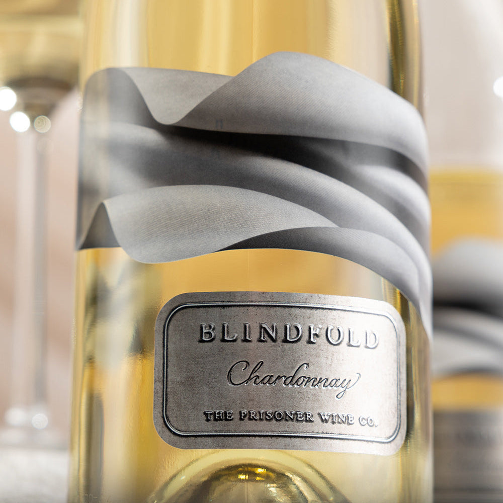 Bottle of Blindfold Chardonnay wine with a gray label.