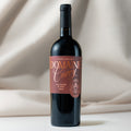 Wine bottle with 'Domaine Curry' label on a neutral background