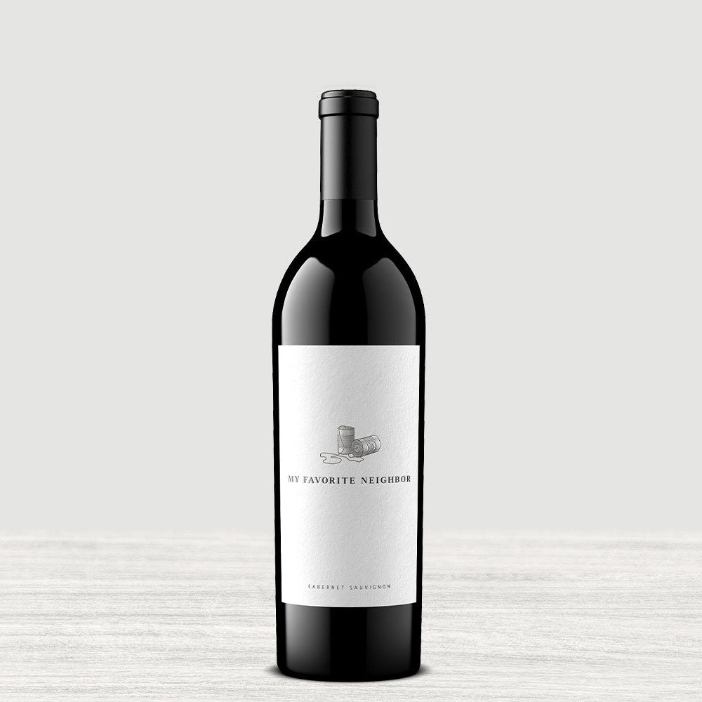 A bottle of My Favorite Neighbor Red on a gray background