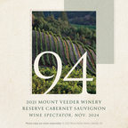 A square featuring a vineyard landscape photo with large white '94' text over it and "2021 Mount Veeder Winery Reserve Cabernet Sauvignon Wine Spectator, Nov. 2024" below on a textured cream background.