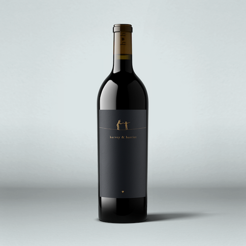 A bottle of 2021 Harvey & Harriet Red Blend wine with a dark label and a simple, elegant design.