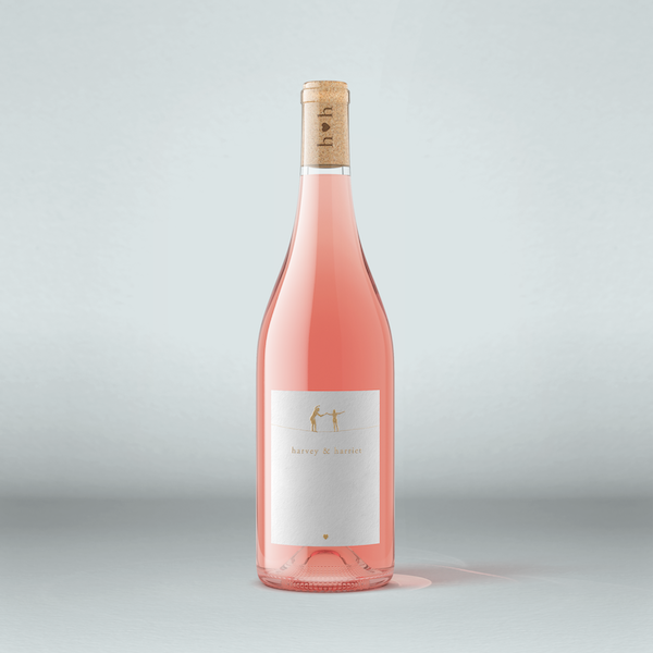 A bottle of Harvey & Harriet rose wine on a white background