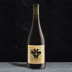 Wine bottle with decorative label on a dark background