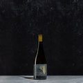 bottle of the white wine bottle Friction on a black background 