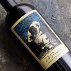 Wine bottle with 'The Prisoner' label featuring an illustration of a prisoner in chains.