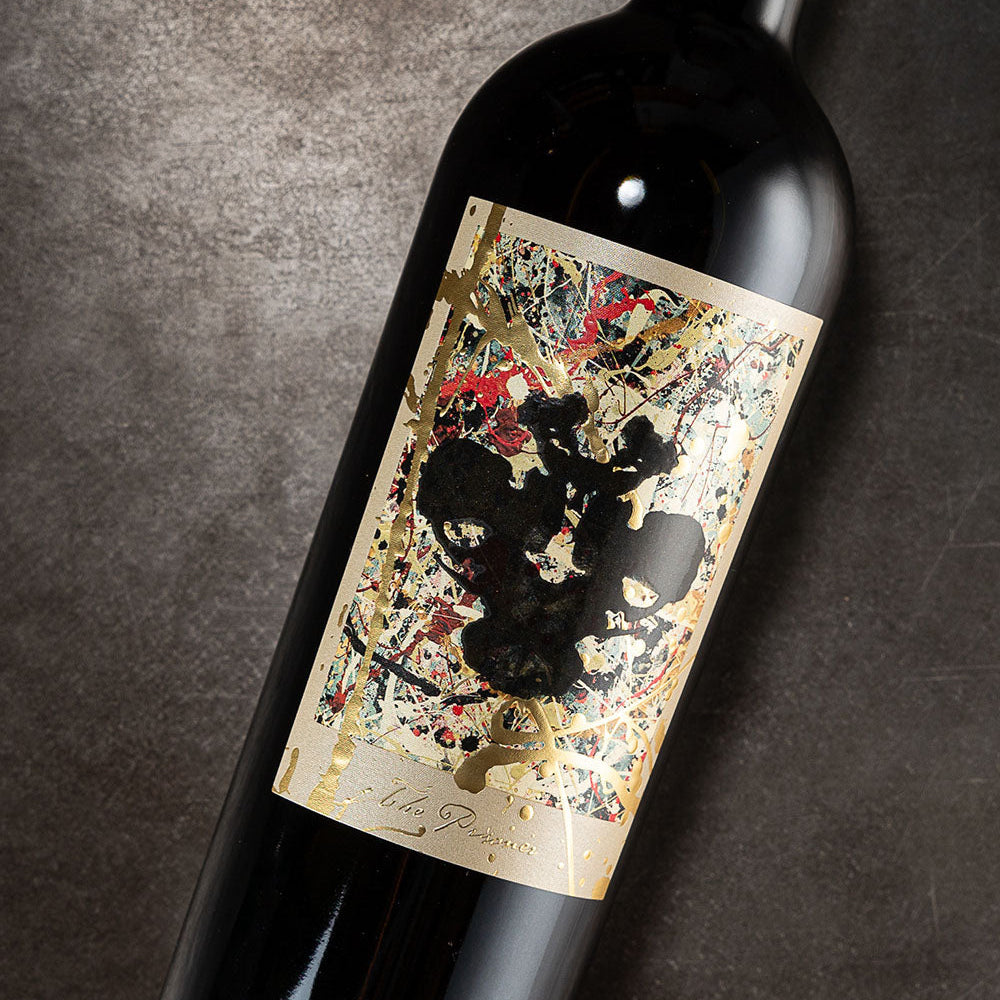 Wine bottle with a decorative label on a dark background