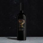A bottle of The Prisoner Reserve Red Blend on a dark background