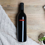 A bottle of SALDO Zinfandel on a wooden surface