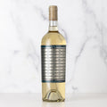 Bottle of Unshackled Sauvignon Blanc with a complicated label on a white background