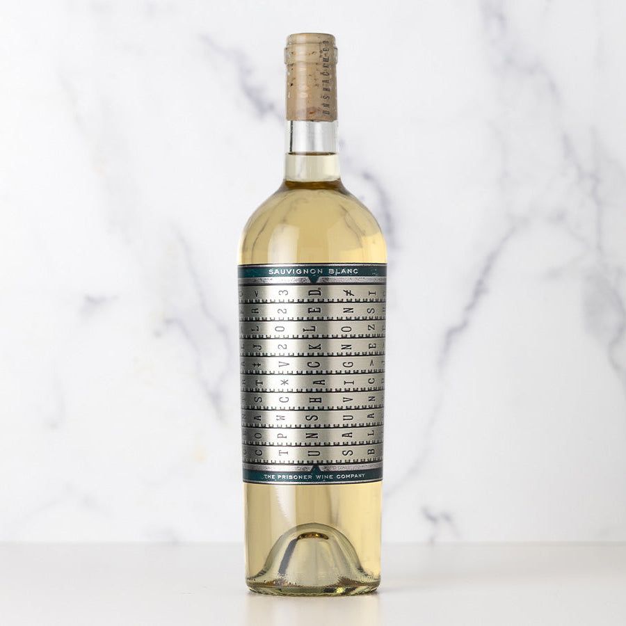 Bottle of Unshackled Sauvignon Blanc with a complicated label on a white background