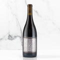 Unshackled Pinot Noir bottle on a white background